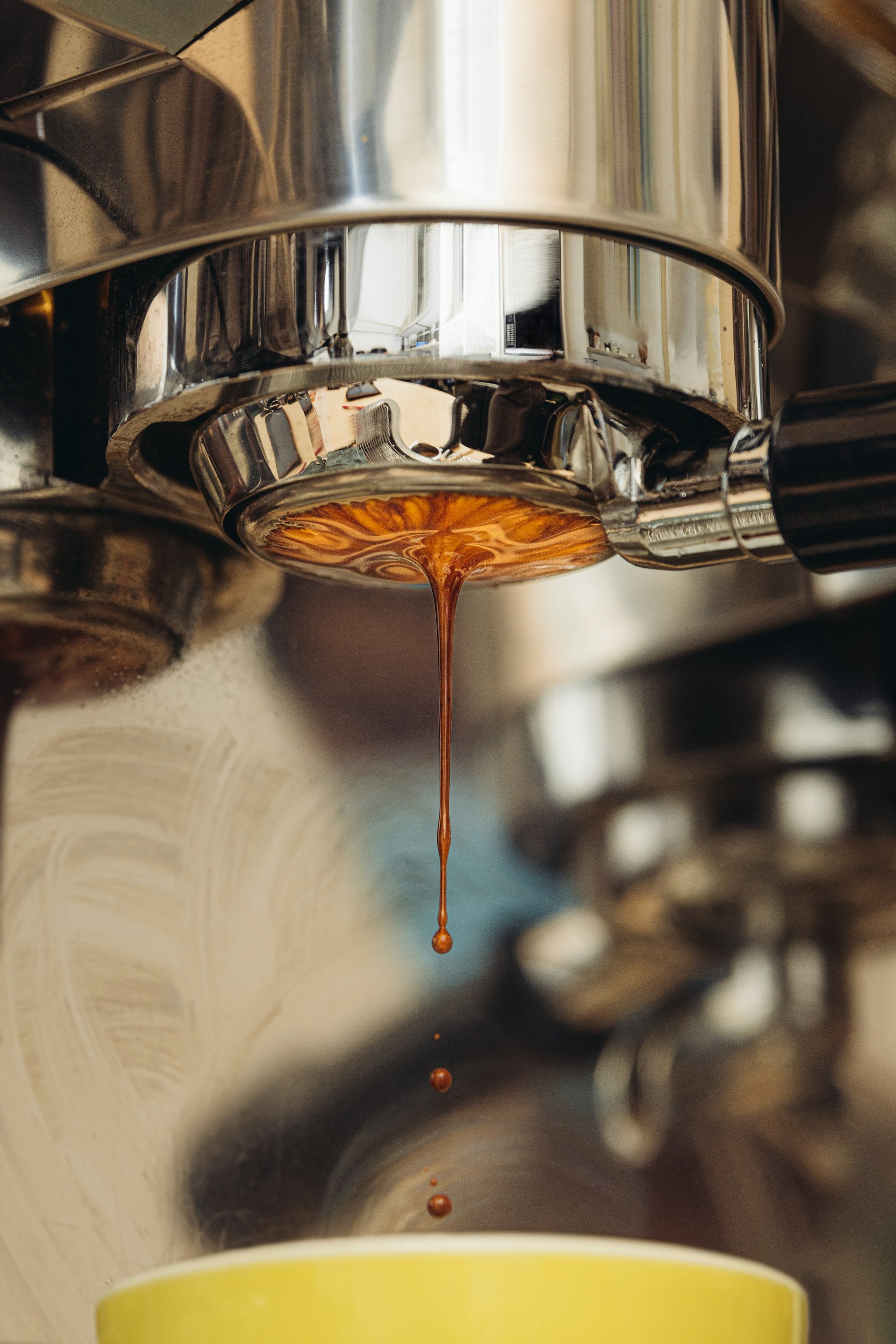 Espresso dripping from a naked portafilter