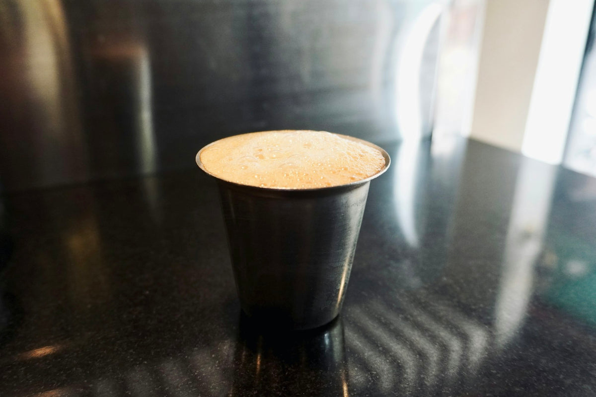 Dark filter coffee in a steel tumbler