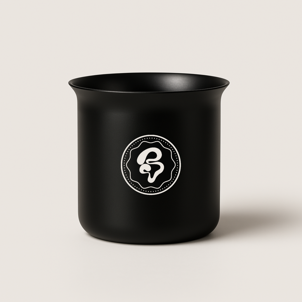 BROOT Dosing Cup in matte black stainless steel with a tapered lip for espresso