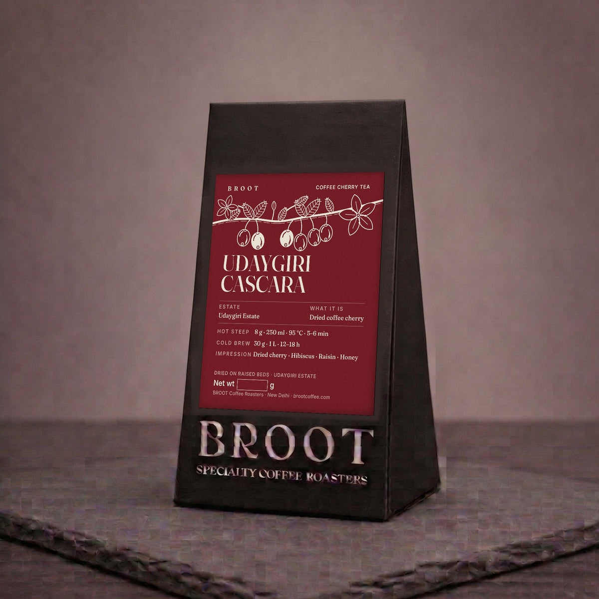 UDAYGIRI CASCARA pack, coffee cherry tea, with coffee cherries and blossom on a branch. BROOT